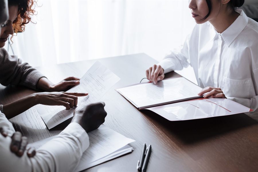 People reviewing documents at a table